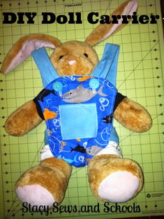 a stuffed animal sitting on top of a table next to a cutting board with scissors