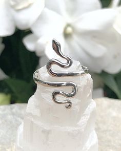 Silver Serpent Ring | The Life Divine Adjustable Sterling Silver Serpent Ring Serpent reminds us to shed our past and old stories the way she sheds her skin, to walk gently and humbly on Mother Earth. Serpent measures approximately 7/8"H x 3/8"W Adjusts from ring sizes 6-9. Handcrafted in Thailand. Adjustable Nickel-free Sterling Silver Snake Ring, Nickel-free Spiritual Jewelry For Promise, Handmade Adjustable Spiritual Snake Ring, Sterling Silver Spiritual Snake Ring As Gift, Sterling Silver Spiritual Snake Ring For Gift, Spiritual Sterling Silver Snake Ring As Gift, Earth Serpent, Silver Snake Ring, 2023 Ideas