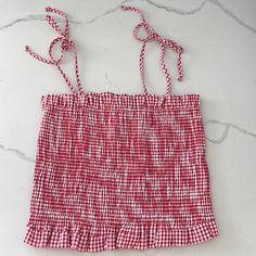 Ripped The Tags Off And Never Wore. Super Comfy And Stretchy Material. Shoulders Tie At The Top. Bought At Dillards Gingham Ruffle Tops For Vacation, Gingham Ruffled Tops For Vacation, Red Sleeveless Top For Picnic, Casual Gingham Tops For Beach, Trendy Red Tops For Picnic, Cotton Gingham Tops For Vacation, Red Summer Tops For Picnic, White Ruffled Top For Picnic, Country Cowgirl