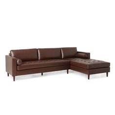 a brown leather sectional sofa sitting on top of a white floor next to a footstool