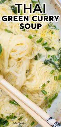 a bowl filled with noodles and vegetables next to chopsticks on top of it