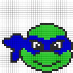 a pixellated image of an alien head in blue and green