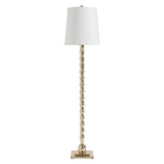 a gold lamp with a white shade on it