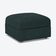 the footstool is made from dark green fabric