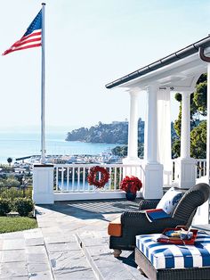 an american flag is flying on the porch