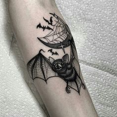 a bat flying through the air with bats on it's wings