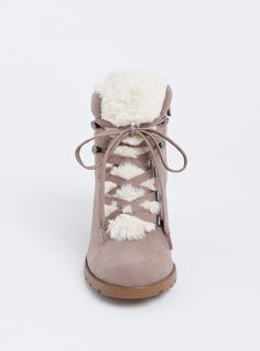 Cozy and cute, these faux suede booties are designed with faux sherpa accents and with a small wedge heel to take you from day to night in style. Our unique fit gives you extra wide width and extra room around your whole foot. EXTRA WIDE WIDTH (WW). Almond toe. Side zip and lace-up closures. Contrast padded faux fur trim. 2. 75” wedge heel. Extra cushioned footbed; textured sole. Man-made materials. Imported extra wide width shoes. The best plus size women's sherpa wedge bootie (ww) flatform & heels in taupe made of suede. Rock your look from Torrid to Festivals like Coachella and Lollapalooza, a concert, a show, or just for fun! Torrid is your destination for cozy fall and winter clothes to keep you warm and comfortable. Trendy Winter Boots With Wedge Heel, Winter Suede Wedge Boots With Round Toe, Synthetic Winter Wedge Heel Boots, Winter Synthetic Wedge Heel Boots, Synthetic Wedge Heel Boots For Winter, Winter Suede Boots With Wedge Heel, Suede Wedge Heel Winter Boots, Suede Wedge Heel Boots For Winter, Womens Sherpa