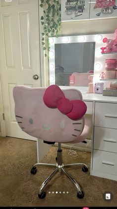 a hello kitty desk chair sitting in front of a vanity with a mirror and lights