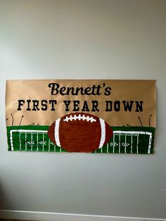 a banner with a football on it that says benett's first year down