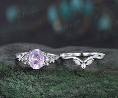 two engagement rings with an oval pink stone in the center