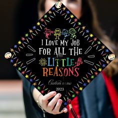 a woman wearing a graduation cap that says i love my job for all the little reasons