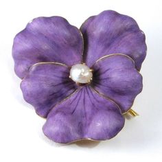 Simply breathtaking 14K antique enamel pansy brooch pendant. Beautiful rich purple matte enamel petals and a natural baroque pearl are all set in 14K gold that has a high carat finish. 1 and ⅛ inch tall, weighs 7.5 grams. The enamel has a couple of tiny nicks at the edge otherwise in very good condition c 1890. Unmarked acid tested and guaranteed solid 14K gold. Matte Purple, Bronze Necklace, Rich Purple, Antique Brooches, Sterling Silver Cuff Bracelet, Lovely Ring, Sterling Silver Cuff, Silver Cuff Bracelet, Drop Necklace