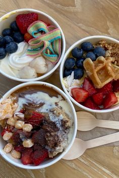 three bowls filled with different types of food