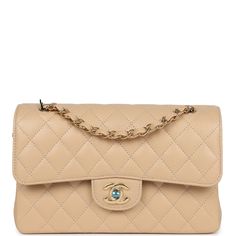 This small classic double flap bag is in beige caviar leather with gold tone hardware and features a front flap with signature CC turnlock closure, half moon back pocket, and adjustable interwoven gold tone chain link and beige leather shoulder strap.The interior is lined in beige leather with the "love letter" zipper compartment underneath the first flap, an "outer" slit pocket under the second flap, and an interior compartment with two open pockets separated by a "lipstick" compartment.Collection: REV (RFID Chip)Origin: FranceCondition: New and never (plastic on hardware)Accompanied by: Chanel dustbag, carebook, retail UPC, ribbon and RFIDMeasurements: 9" width x 5.25" height x 2.5" depth; 16.5" strap drop (9.5" doubled) Classic Flap Bag, Hermes Birkin 25, Handbag Wallet, Wallet Accessories, Love Letter, Classic Flap, Flap Bag, Half Moon, Prada Bag