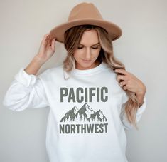 Pacific Northwest Graphic Sweatshirt, PNW Crewneck, Coastal Hiking Adventure Pullover ►FEATURES ABOUT THE GARMENT  for any situation, a unisex heavy blend crewneck sweatshirt is pure comfort. These garments are made from polyester and cotton. This combination helps designs come out looking fresh and beautiful. The collar is ribbed knit, so it retains its shape even after washing. There are no itchy side seams on these sweaters.  .: 50% cotton, 50% polyester .: Medium-heavy fabric (8.0 oz/yd² (27 White Cotton Sweater For Outdoor, White Long Sleeve Adventure T-shirt, White Long Sleeve T-shirt For Adventure, White Long Sleeve Sweatshirt For Adventure, Hiking Adventure, Pacific Northwest, North West, Sew-in Labels, San Jose