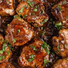 meatballs covered in sauce and garnished with parsley