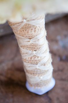 a spool of twine is wrapped in burlap