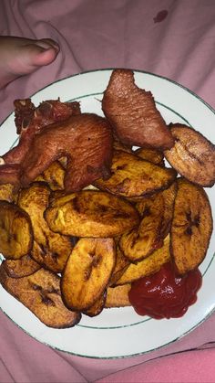 the plate is full of cooked bananas and meat