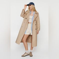 Layer Up. Feel Confident In This Classic Trench Coat, With A Classic Longline Design And A Belted Waistline. Pairs Well With A Casual Fit For An Elevated Daytime Look, Or Wear It Over A Mini Dress For A Levelled Up Night Out Look. Petite Essentials Trench Coat Statement Wide Collar Belted Waist And Cuffs Iconic Longline Cut Button Front Fastenings Deep Pocket Accents Banana Republic Camel Coat, Banana Republic Women Coat, Single-breasted Long Khaki Outerwear, Banana Republic Trench Coat Women, Utility Long Sleeve Gabardine Outerwear, Banana Republic Trench Coat, Classic Trench Coat, Casual Fit, Long A Line