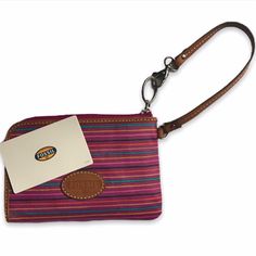 Nwt, Never Used With The Stuffing And Fossil Card In Tact Pink Stripe Canvas Printed Pattern And Brown Leather Wristlet Strap Brown Fossil Logo In Mint Condition Inner Lining: Light Orange/Salmon Room For Your Cash And Cards L-Shaped Zipper Perfect Compartmental Size, Will Fit Perfectly In A Purse Or On Your Wrist Condition: Nwt, Very Slight Unnoticeable Crease On The Backside From Storage (Bottom Left, Third Photo) Casual Pink Wristlet For Everyday Use, Casual Pink Everyday Wristlet, Salmon Room, Orange Salmon, Fossil Wallet, Fossil Bags, Wristlet Wallet, Leather Wristlet, Light Orange