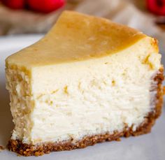 a piece of cheesecake on a plate with strawberries