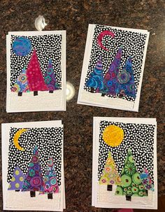 four small cards with different designs on them