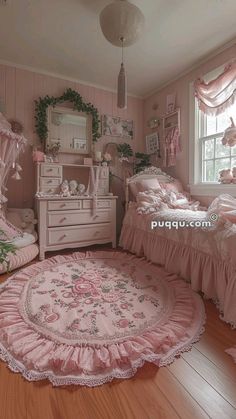 a bedroom with pink bedding and furniture