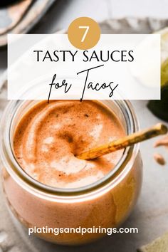 a jar filled with tasty sauces on top of a table