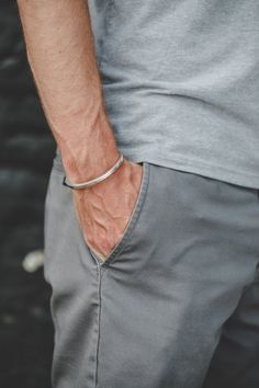 This handmade cuff bracelet is made from solid sterling silver. Our Heavy Cuff goes well with everything from jeans and a t-shirt to pairing with other jewelry for a night on the town. You can't go wrong with this simple statement cuff.Cuff is slightly adjustable by bending to shorten or widen the gap of the bracelet.Male model is wearing a large sized bracelet.Female model is wearing medium sized bracelet.To find your cuff size, measure your wrist and find where that measurement falls in our ch Modern Cuff Bracelet For Everyday Wear, Classic Adjustable Cuff Sterling Silver Bracelet, Classic Stainless Steel Cuff Bracelet For Everyday, Modern Cuff Bracelets For Everyday Wear, Adjustable Classic Sterling Silver Cuff Bracelet, Classic Adjustable Sterling Silver Cuff Bracelet, Modern Everyday Cuff Bracelets, Adjustable Sterling Silver Timeless Bangle, Modern Silver Bangle For Everyday