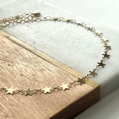 "Boho Beach Star Choker... ~available in tarnish resistant Silver/14kt gold plated metal or 14kt gold filled (not plated) ~adjustable length 14-16\" (custom length available upon request) ~Specially packaged and ready for gift giving Please visit my shop for more great jewelry finds: ChrisKateJewelry.etsy.com Current Processing Times All of my items are lovingly handcrafted and made-to-order so please be sure to view my shop announcement on my shop's main page for the most up-to-date processing 14k Gold Filled Star Jewelry For Gifts, Star-shaped 14k Gold Filled Jewelry Gift, Star Choker, Macrame Bracelets, Main Page, Gold Star, Boho Beach, Gold Stars, 14kt Gold