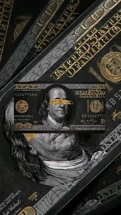 the dollar bill has been cut into smaller pieces and is laying on top of each other