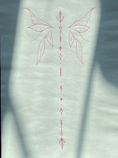 a drawing of a cross with red lines on it and arrows drawn across the back