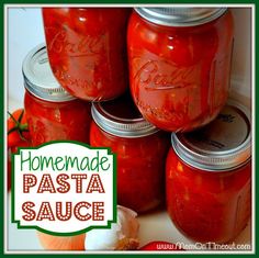 homemade pasta sauce in jars with tomatoes and garlic