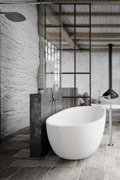 a large white bath tub sitting next to a bathroom sink