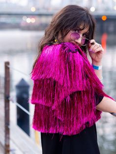 "Welcome to the most fabulous fringe jacket you'll ever lay your eyes on! This Fuchsia Tinsel Fringe Crop Jacket is the ultimate showstopper that will make you shine like a star. The dazzling fuchsia tinsel fabric catches the light in all the right ways, while the playful fringe adds movement and texture to your look making you the center of attention at any party. Perfect for a night out with the girls or a daring fashion statement, this crop jacket is the epitome of fun and flirty style.  Who Pink Fringe Outfit, Tinsel Fringe Jacket, Pink Fringe Jacket, Karma Jacket, Fringe Outfit, Tinsel Jacket, Fringe Clothing, Flirty Style, Shine Like A Star