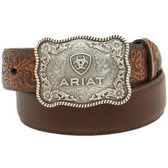 Style number: A1301002 Brown full-grain leather belt. Floral tooled design on billets. 1/4 inch belt width. Antique silver large square belt buckle with scroll filigree and Ariat shield logo and roped scalloped edges. Square Belt Buckle, Tooled Belt, Boys Belt, Tooling Patterns, Shield Logo, Tool Belt, Branded Belts, Leather Floral, Western Leather