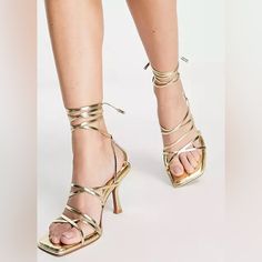 New Beautiful Hiccup Strappy Tie Leg Mid Heeled Sandals In Gold Gold Lace-up Sandals With Heel Strap For Summer, Gold Strappy Lace-up Sandals, Chic Gold High Heel Lace-up Sandals, Gold Lace-up Sandals For Summer With Open Heel, Gold Strappy Heels For Summer, Gold Lace-up Sandals For Summer, Chic Gold Lace-up Sandals For Party, Gold Strappy Lace-up Sandals For Party, Trendy Gold Strappy Sandals