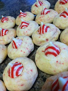 red and white candy cane cookies on a counter with peppermint candies in the middle