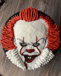 a cake that looks like it has been made to look like the evil clown from it's movie