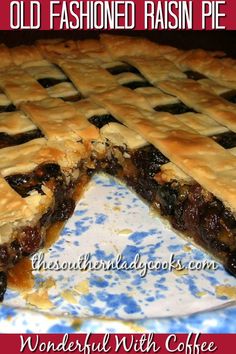 an old fashioned raisin pie is cut in half on a blue and white plate