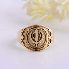 About item Item :- Sikh Khanda Khalsa Ring Ring size :- Chose from variation (Custom size accepted) Material  :- Sterling Silver and Brass (Choose from Variation) Title:-Handmade Sikh Khanda Khalsa Signet Men's Sterling Silver Ring Gift For Him, Khanda ring in Handmade, 14k 22k Gold Ring, Valentines Gift Ring Description:- We accept all types of custom & personalized order. Please send us a message if you are interested in a custom creation. ♥ Is brass harmful for skin? As such, if you're wearing a brass ring, it is most likely to leave a green mark on your skin when you sweat or wash your hands. This is generally not harmful or painful (it is just oxidation of the metal) and will go away within a few hours of removal. Please keep it away from water or any chemical. Shipping profile:- We s Khanda Ring Gold, Traditional Engraved 14k Gold Ring, Traditional 14k Gold Ceremonial Rings, Traditional 14k Gold Hallmarked Rings, Traditional Hallmarked 14k Gold Rings, Traditional Gold Engraved Signet Ring, Traditional Hallmarked Brass Rings, 22k Gold Ring, Silver Jewelry Design