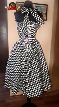 This lovely cotton polka dots details  dress has a classic 1950s silhouette. The full skirt compliments all figures beautifully.The back has a corset so you can adjust it perfect for your body.Each piece is unique and carefully crafted by hand.If you want different colors please contact us.Custom made so it can fit you like a glove. Measures that we need: Bust:Waist:Hips:Bust to waist:Waist to how long you want the dress: Fitted Cotton Rockabilly Dress, 1950s Silhouette, Plus Size Rockabilly, Corset Plus Size, Bride Dressing Gown, Velvet Duster, Feather Gown, Gown Photos, 50s Dresses