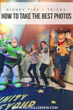 some people are posing for a photo with toy story characters