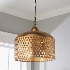 a light fixture hanging from a ceiling in a room