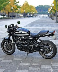 a black motorcycle parked on the side of a street