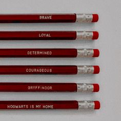 six red pencils with writing on them that say, brave, loyal, determined, courageous, gryfff indor and harry potter's is my home