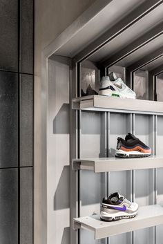 there are several pairs of shoes on the shelves