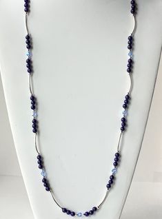 Dark Blue Lapis Lazuli gemstones have a deep,rich,navy blue color that contrasts beautifully with sterling silver. This very long statement necklace can be doubled into a shorter piece which makes it very versatile! The curved sterling tube beads add a nice sense of movement and the light blue 6mm Sapphire Polished Beads Lapis Lazuli Necklace, Sapphire Lapis Lazuli Necklace With Polished Beads, Elegant Lapis Lazuli Necklace With Polished Beads, Elegant Sapphire Lapis Lazuli Beaded Necklace, Elegant Sapphire Necklaces With Polished Beads, Elegant Sapphire Necklace With Polished Beads, Elegant Single Strand Lapis Lazuli Beaded Necklaces, Elegant Lapis Lazuli Gemstone Beaded Necklaces, Elegant Single Strand Lapis Lazuli Beaded Necklace