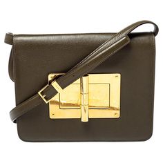 This Natalia bag from Tom Ford is here to end all your fashion woes, as it is striking in appeal and utterly high on style. It has been crafted from leather and designed with a flap that has a large turn lock carrying the signature TF engravings. The Alcantara insides are spacious and the bag is complete with a shoulder strap. This ultra-modern bag will lend you just the right amount of class and make you stand out like a true fashionista! Includes: Original Dustbag, Info Booklet Tom Ford Bag, Modern Bag, Ultra Modern, Green Leather, Tom Ford, Wedding Accessories, Luxury Bags, Olive Green, Bags Designer