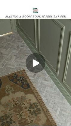 an image of a kitchen with green cabinets and rug on the floor in front of it